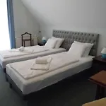 Millennium Gazde/Camere de închiriat *